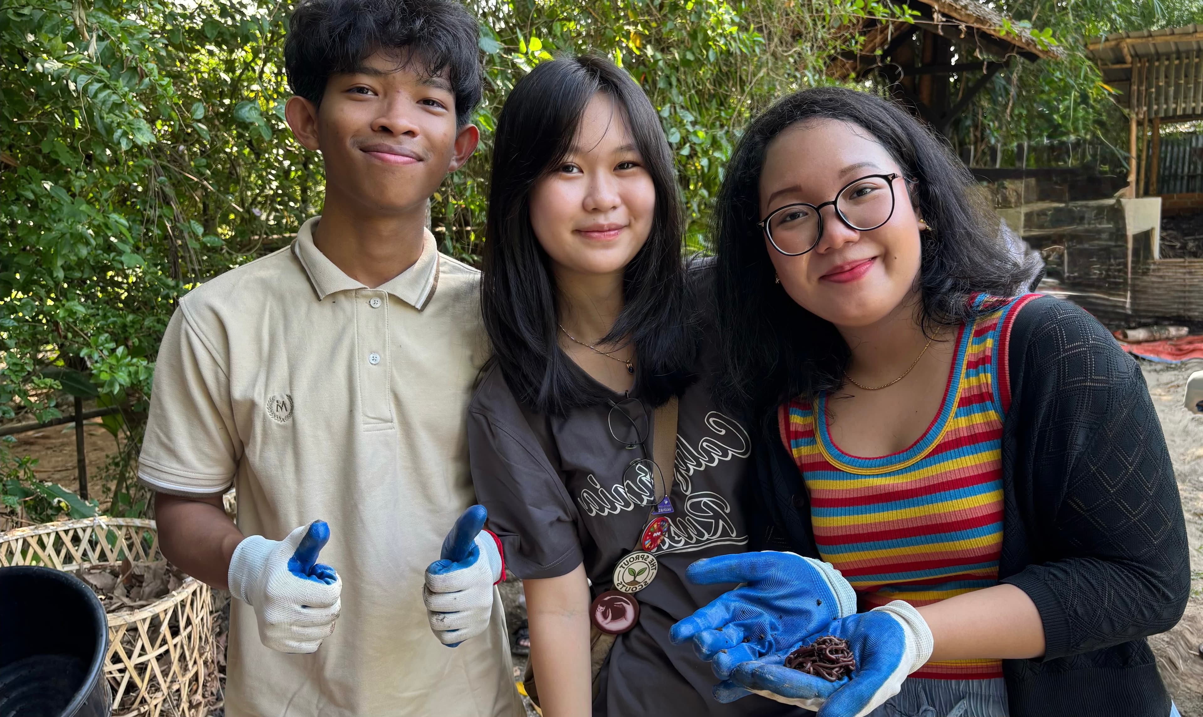Youth volunteers in a green outdoor setting